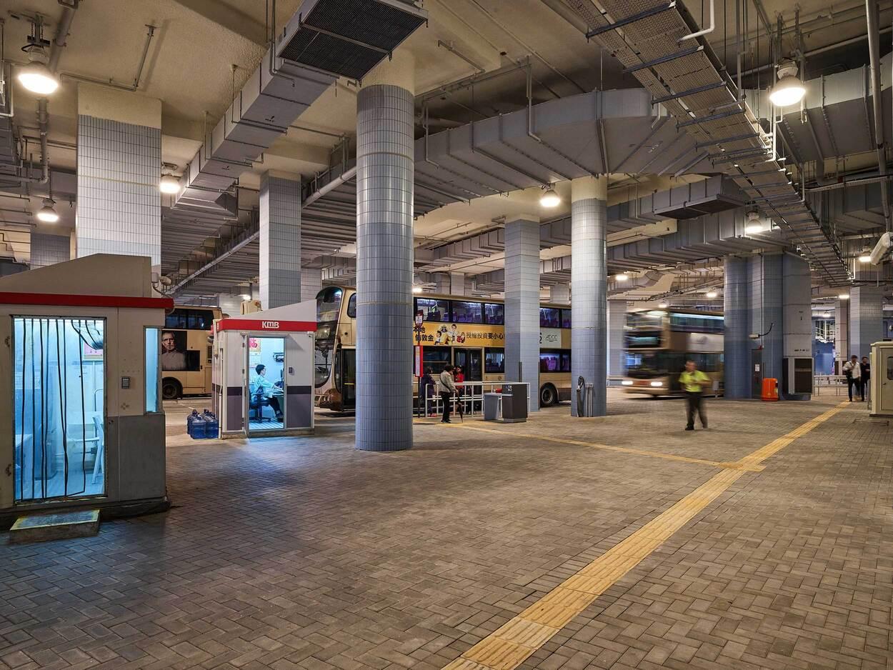Spacious underground parking garage interior with vending machines and bright lighting