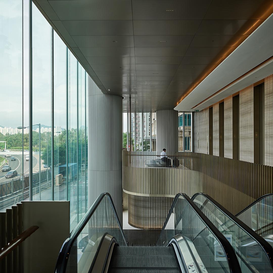 Interior of modern building with escalator and large glass walls