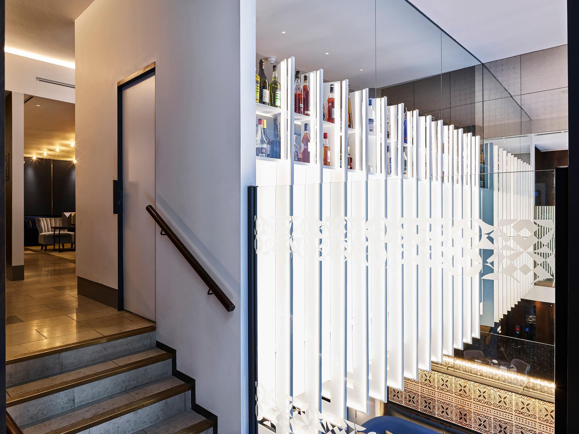 Acosorb acoustic panels installed next to an office staircase for sound control