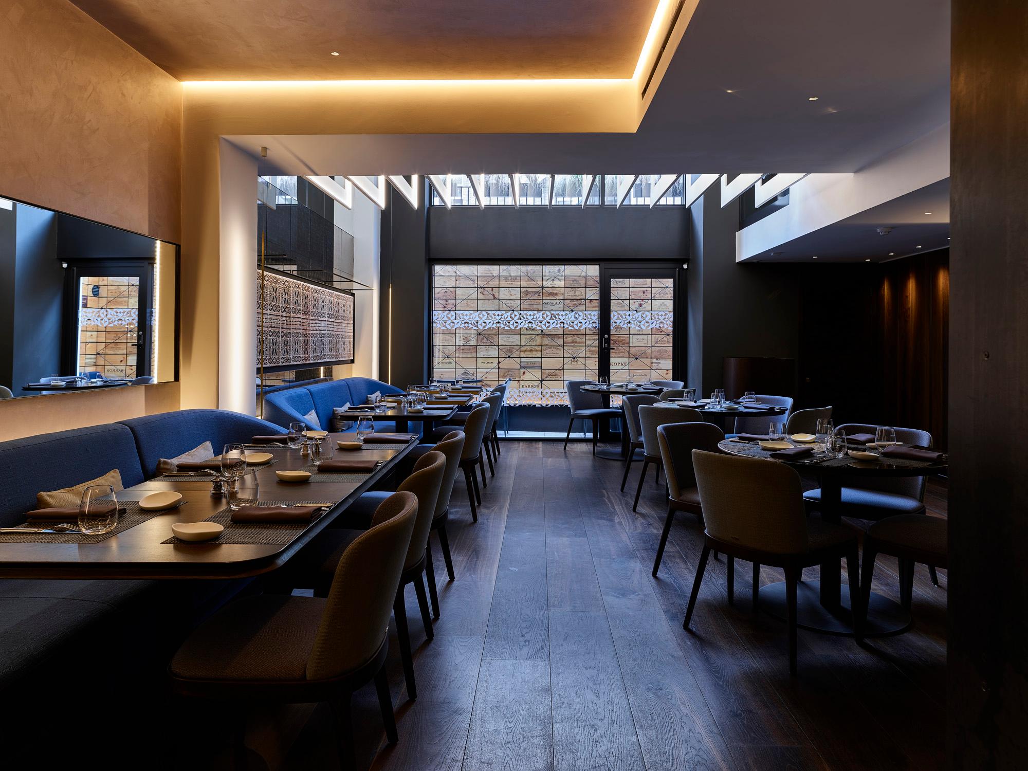 Hotel restaurant with Acosorb acoustic ceiling and modern interior design