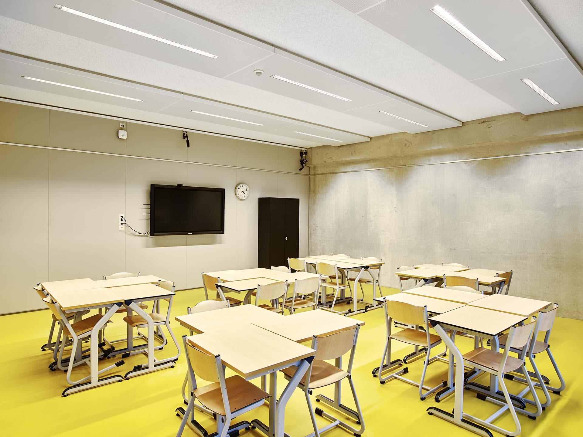 Modern classroom at Melanchthon school with yellow floor and student desks